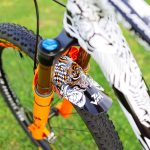 JM Graphics Mud Shield - Custom gloss white and orange graphics with black background